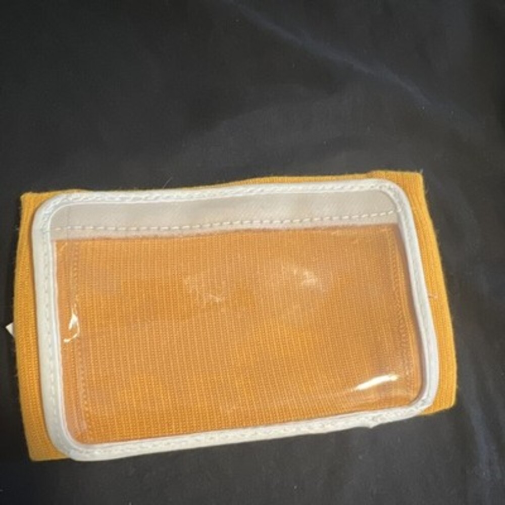 Yellow play holder for football/baseball